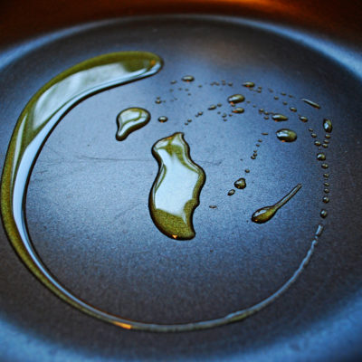 Swirl of cooking oil on fry pan